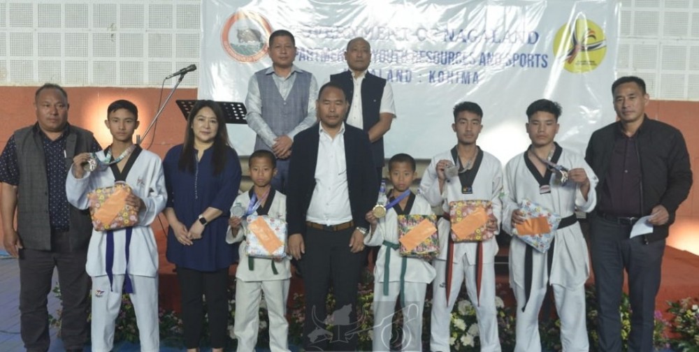 Advisor Keoshu and officials with the medal winners (taekwondo) at Hall A, I G Stadium, Kohima on April 11. (DIPR Photo)